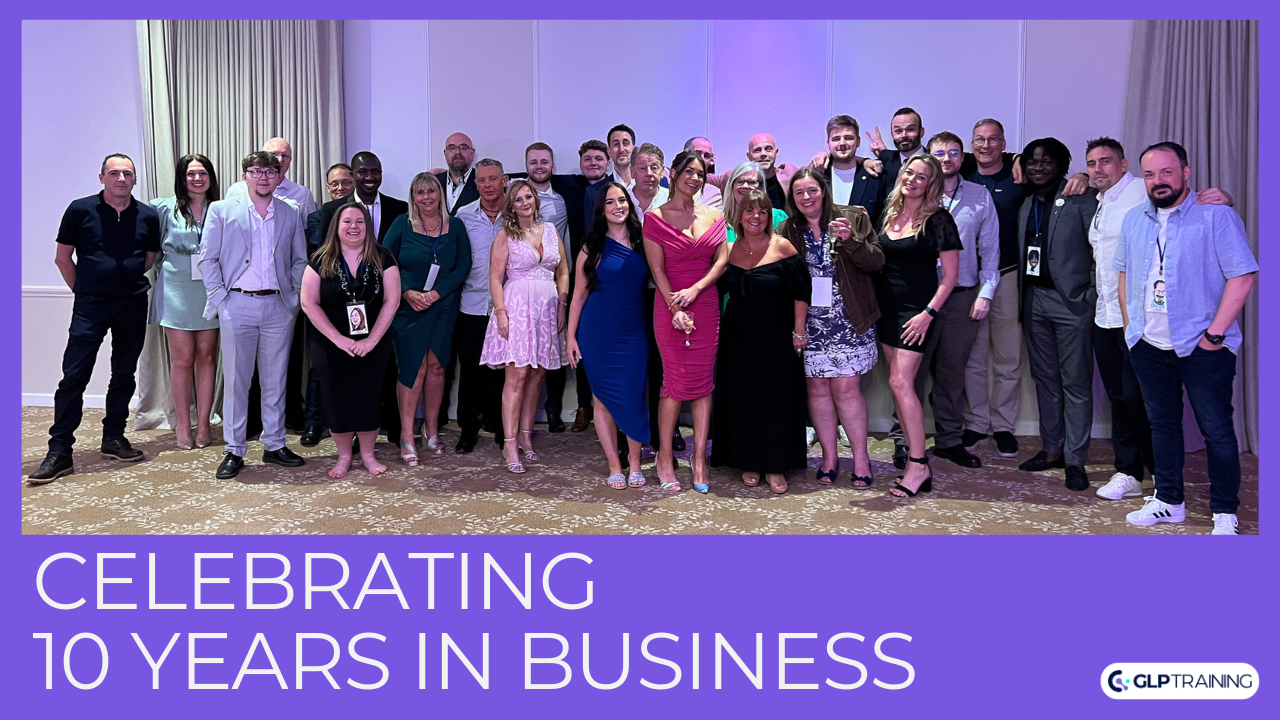 Celebrating 10 Years in Business. The team are photographer in formal wear at an event.