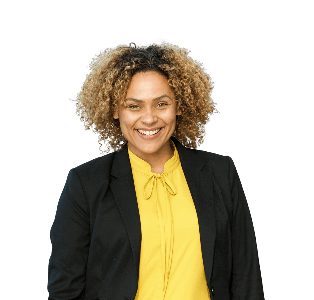 A woman smiles widely at the camera.