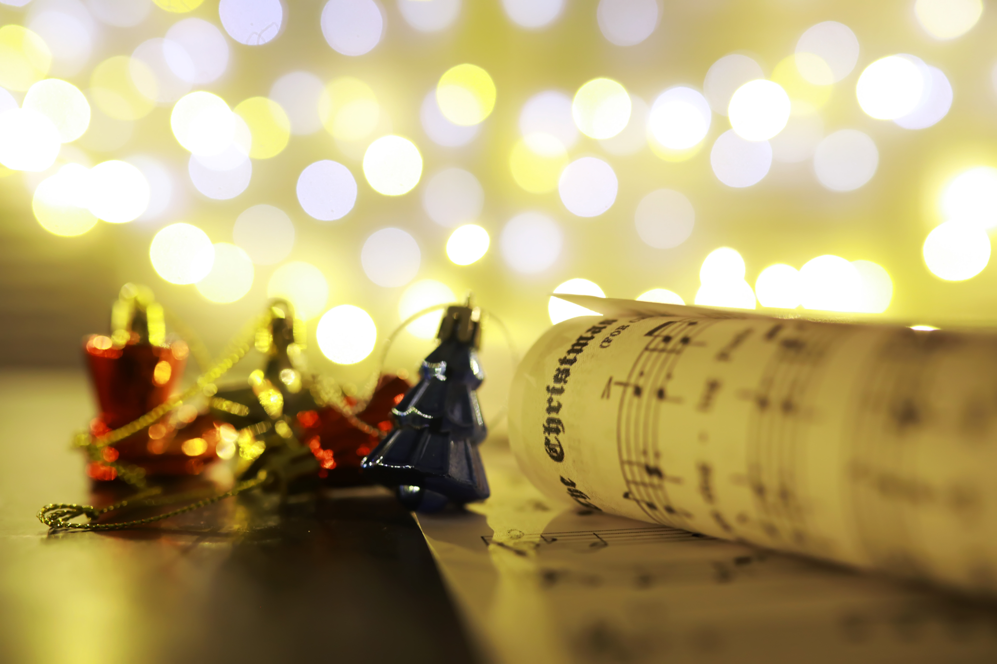 Christmas Sheet Music. Christmas decorations on music sheets, closeup